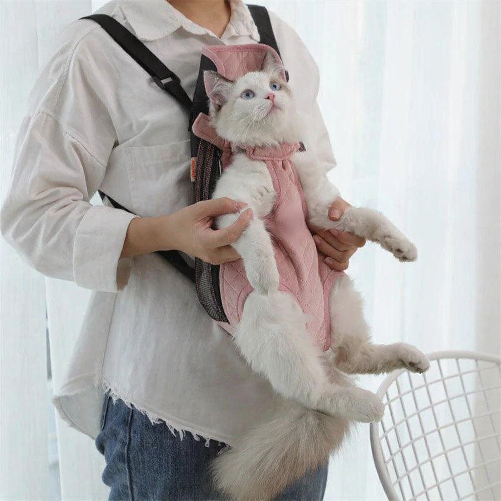 Catvera Cat Carrier Front Sling - Image 21|||PROMPT|||Cleaned image. Original analysis: Found 1 watermark/logo on the cat's outfit - a circular badge/emblem visible on the pink garment the cat is wearing