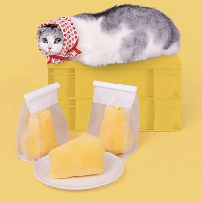 Catvera Cheese Catnip Plush Toy - Image 9|||PROMPT|||Cleaned image. Original analysis: Found 1 brand name/logo on the product - a small tag or label visible on one of the cheese prop bags in the lower portion of the image