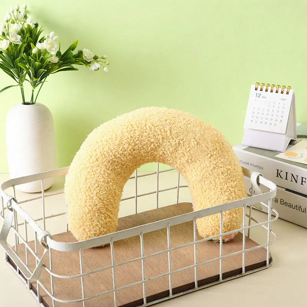Catvera Crescent Cat Comfort Pillow - Image 5|||PROMPT|||Cleaned image. Original analysis: Found 1 brand name printed on product and 1 brand name on book spine