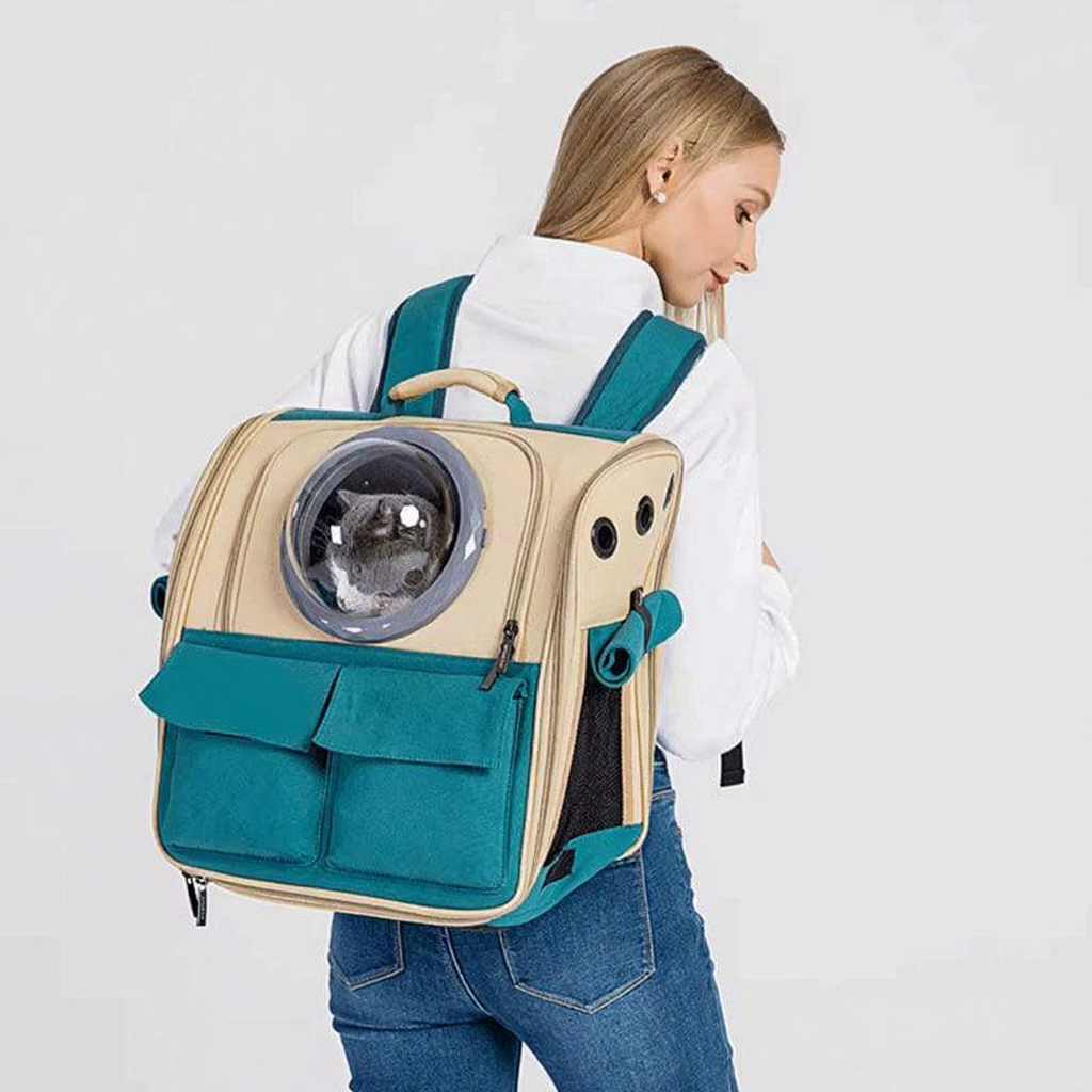 Catvera Expandable Canvas Cat Carrier Backpack - Image 13|||PROMPT|||Cleaned image. Original analysis: Found 1 brand name 'Spaccat' printed on the front teal pocket of the backpack