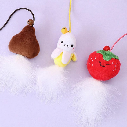 Catvera Feather Bell Catnip Wand - Image 11|||PROMPT|||Cleaned image. Original analysis: Found 3 brand name labels on the plush toys. Each of the three ornaments (brown pear, white banana, and red strawberry) has a 'CHAOMBIN' brand label tag attached to it.