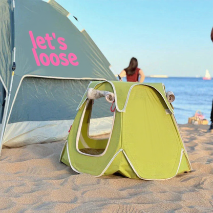 Catvera Foldable Outdoor Cat Tent - Image 10|||PROMPT|||Cleaned image. Original analysis: Found text/branding on the large tent/kite in the background that reads 'let's loose' and contains decorative pink elements and text that appears to include branding or messaging