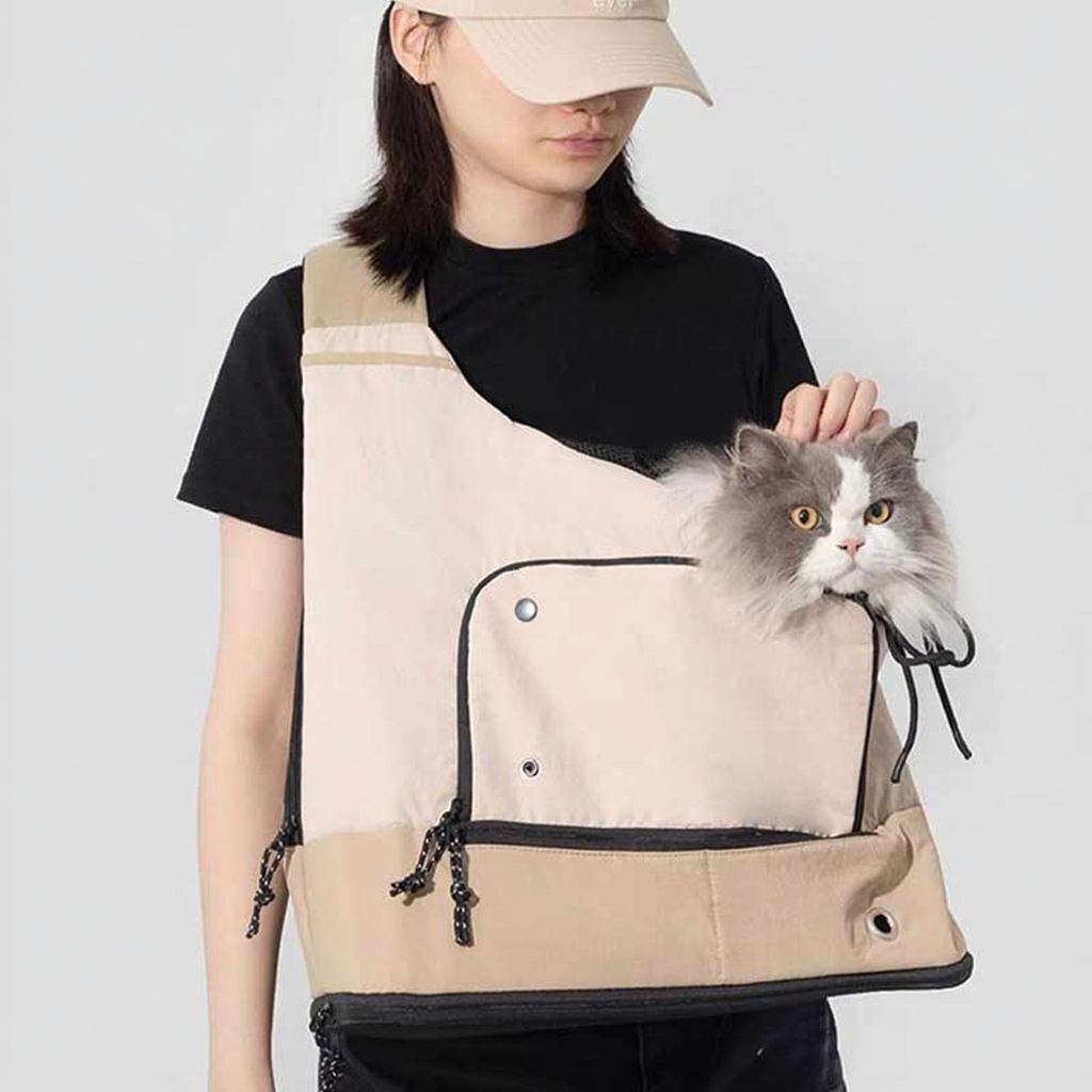Catvera Front Facing Cat Carrier Backpack - Image 6|||PROMPT|||Cleaned image. Original analysis: Found 2 brand names: 'RIDEBEAN' label on the carrier bag, and 'MAKE' text printed on the black t-shirt worn by the model
