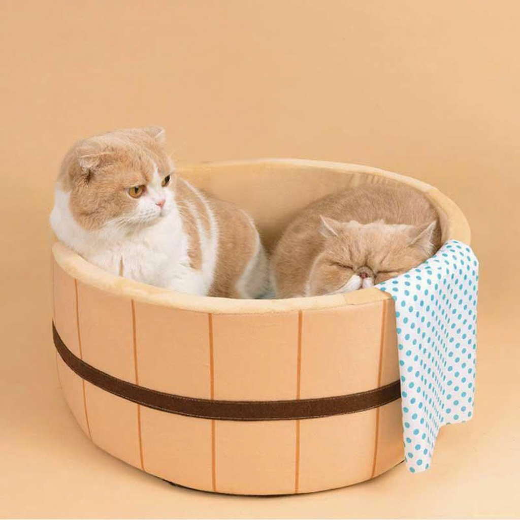 Catvera Japanese Hot Spring Cat Bed - Image 1|||PROMPT|||Cleaned image. Original analysis: found 1 brand name/text on the wooden sign above the bathtub and 1 brand indicator on the towel
