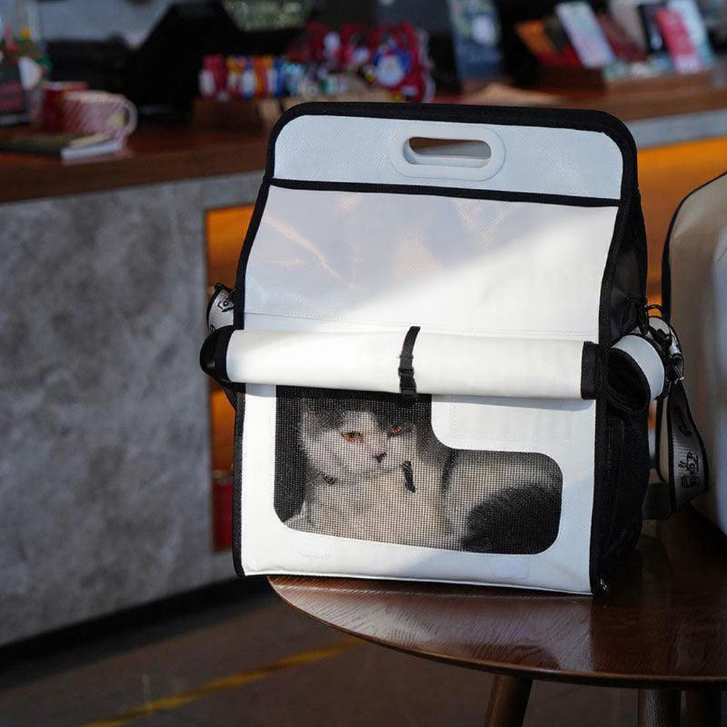 Catvera Milk Carton Cat Carrier - Image 2|||PROMPT|||Cleaned image. Original analysis: Found 1 brand name/logo on the product - visible branding on the black side panel/strap area of the pet carrier