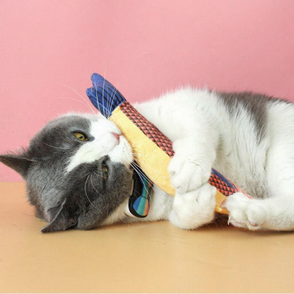 Catvera Plush Catnip Fish Toy - Image 15|||PROMPT|||Cleaned image. Original analysis: Found 1 brand logo on the toy/product itself - a red shield-shaped logo visible on the yellow fabric toy that the cat is playing with