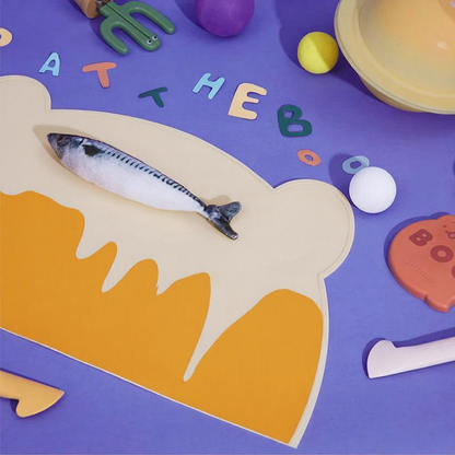 Catvera Silicone Cat Food Feeding Mat - Image 4|||PROMPT|||Cleaned image. Original analysis: Found 3 brand names/logos: 'PATTEBOO' printed on the yellow product base, 'PTBBABY/2023' text overlay on the right side, and smiley face emoji watermarks in the top right corner
