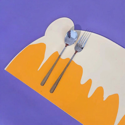 Catvera Silicone Cat Food Feeding Mat - Image 5|||PROMPT|||Cleaned image. Original analysis: Found 1 brand name printed directly on the product - 'PATTHEBOO' text visible on the orange plate/placemat