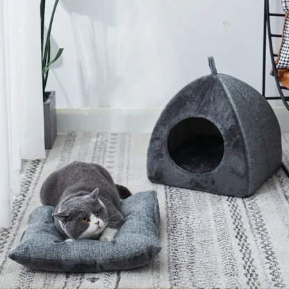 Catvera Triangle Enclosed Cat Nest - Image 2|||PROMPT|||Cleaned image. Original analysis: Found 1 brand name label on the cat bed/mat and 1 brand name on the cat cave/house