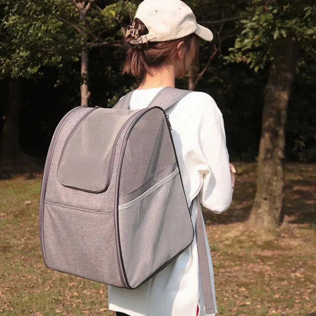 Foldable Pet Backpack with Mesh Windows - Image 4|||PROMPT|||Cleaned image. Original analysis: Found 1 brand name/logo on the pet backpack carrier and 1 small brand mark on the shoulder strap